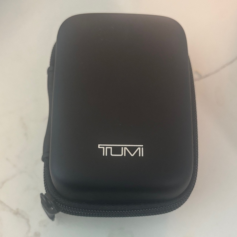 TUMI universal power adapter and case